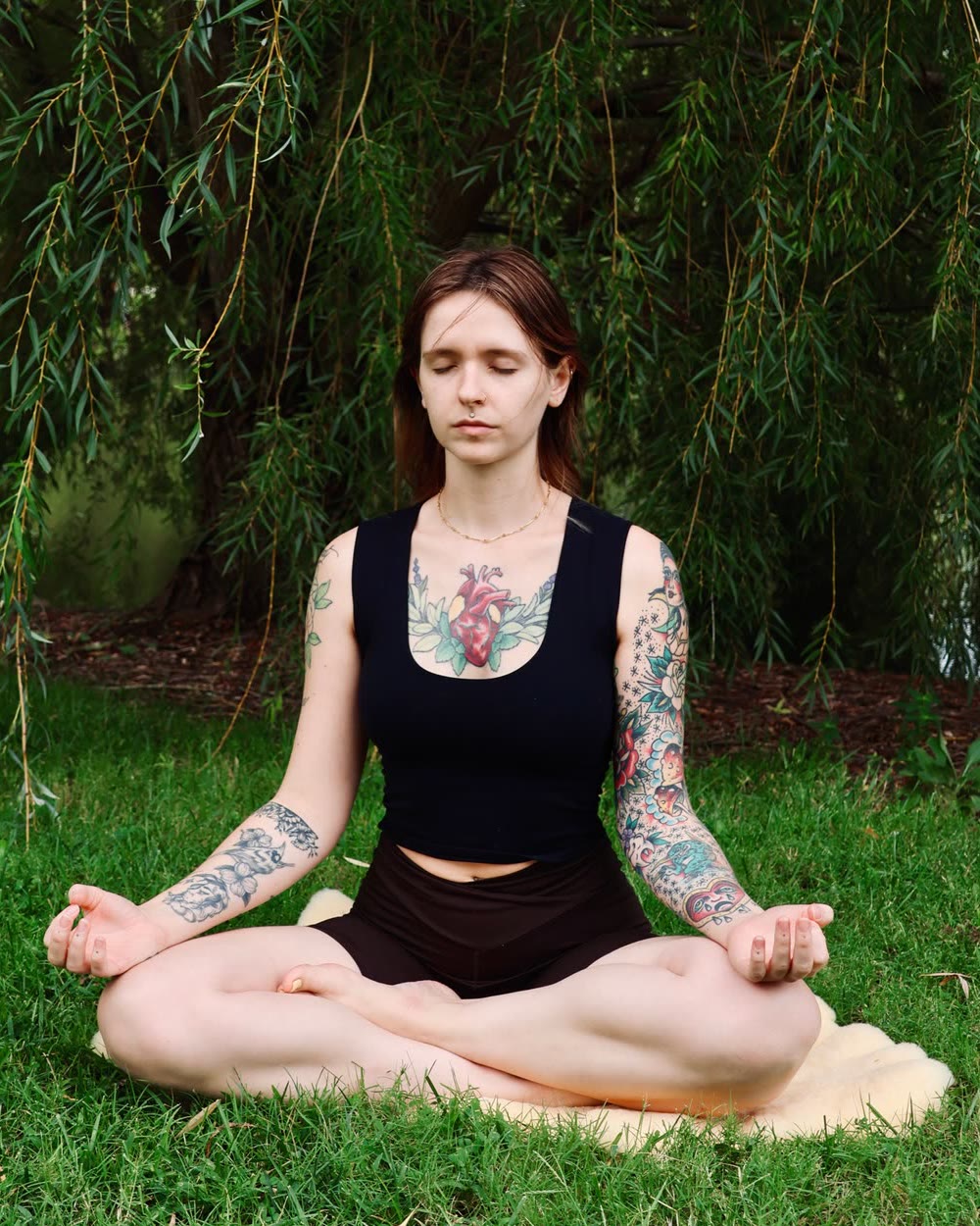 Anna Shirley meditating under a willow tree